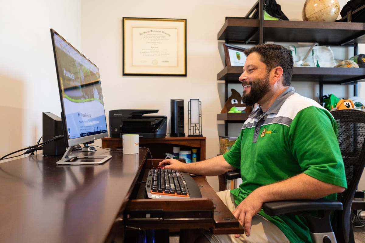 DoodyCalls franchise owner working on computer in office