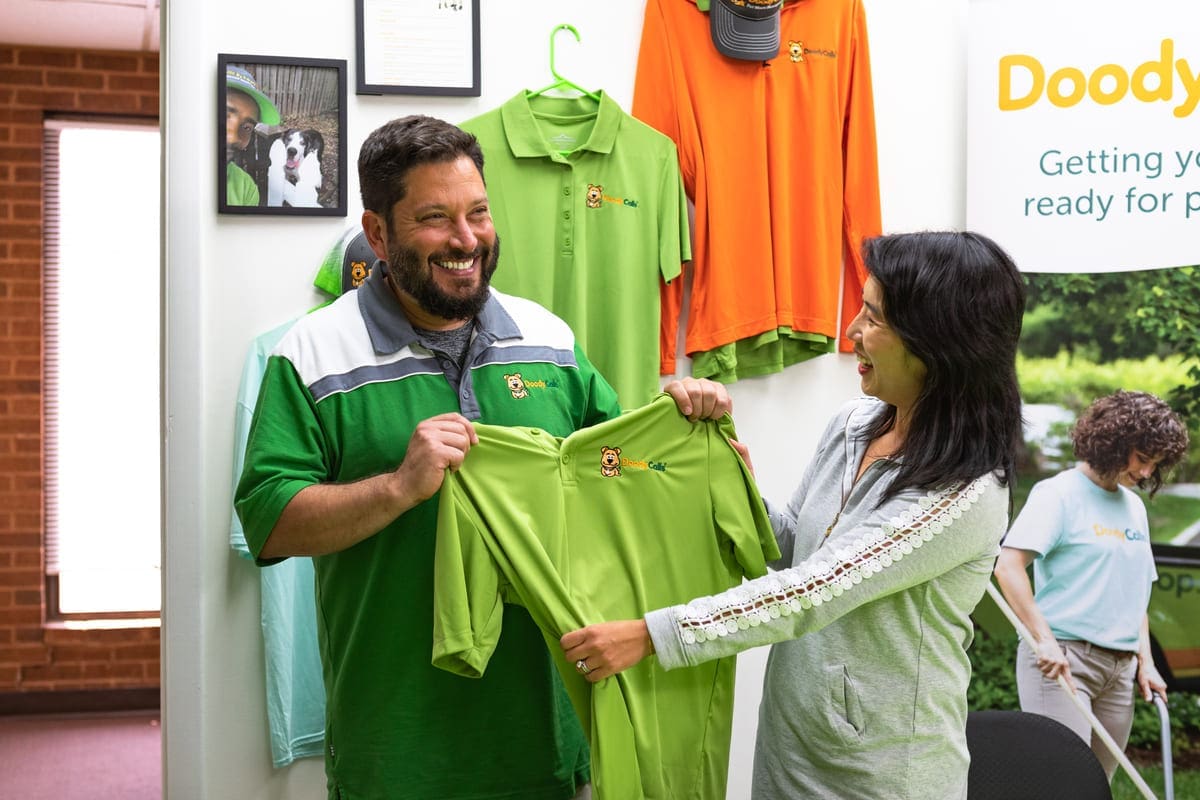 DoodyCalls franchise owner selecting uniform shirts