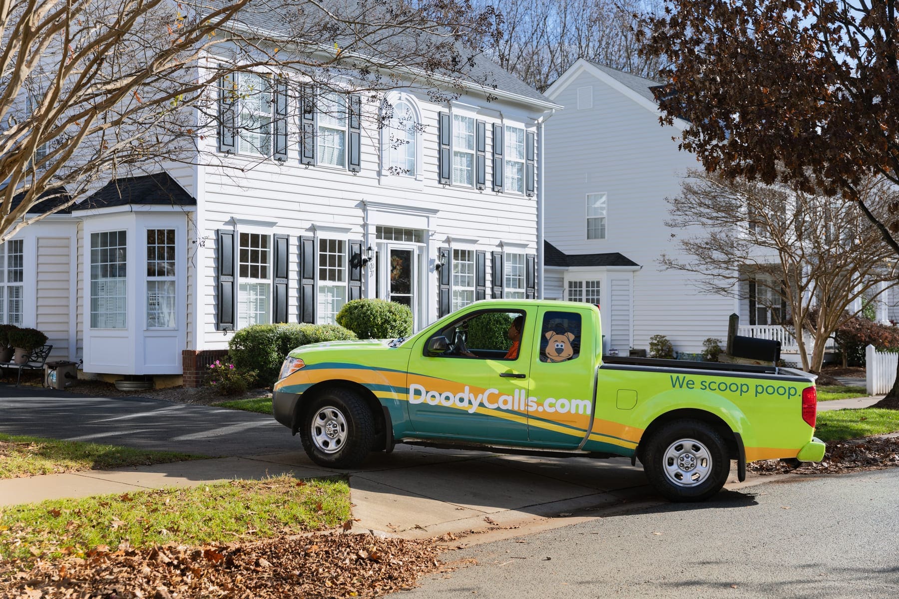 DoodyCalls technician in truck arriving at customer's house